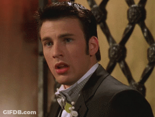 A Man In A Tuxedo With A Bow Tie Is Making A Surprised Face GIF
