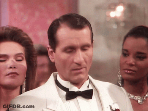 Man In Tuxedo Looking Down GIF