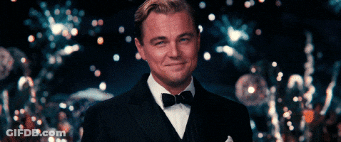 A Man In A Tuxedo With A Bow Tie Smiles GIF