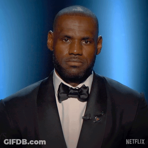 A Man In A Tuxedo With A Netflix Logo On The Bottom GIF