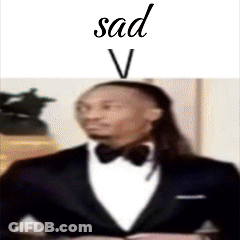 A Man In A Tuxedo With The Word Sad On Top Of Him GIF