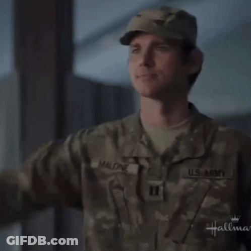 A Man In A U.s. Army Uniform Saluting GIF