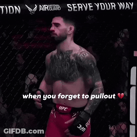 A Man In A Ufc Belt Stands In Front Of A Sign That Says " Serve Your Nation " GIF