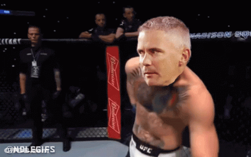 A Man In A Ufc Ring With A Budweiser Bottle On His Chest GIF