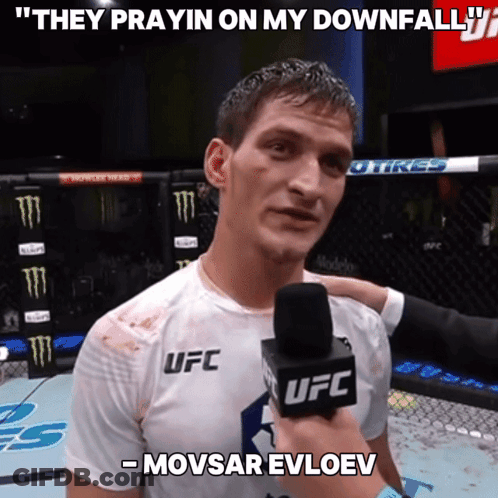 A Man In A Ufc Shirt Is Being Interviewed By A Ufc Reporter GIF