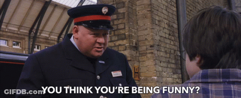 A Man In A Uniform Asks A Boy If He Thinks He 'S Funny GIF