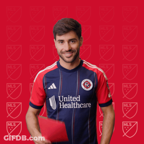 A Man In A United Healthcare Jersey Holds A Red Card GIF