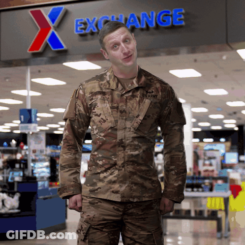 A Man In A Us Army Uniform Stands In Front Of An X Exchange Sign GIF