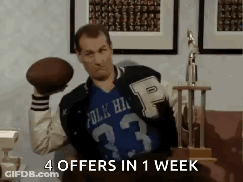 Man In Varsity Jacket Holding Football GIF