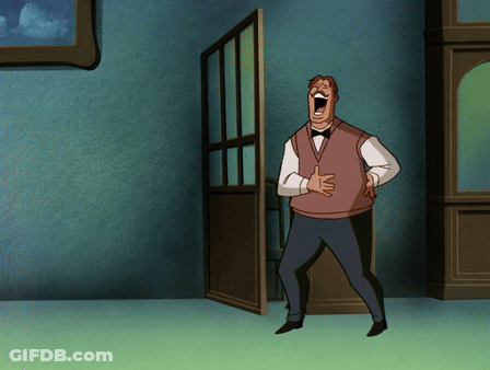 A Man In A Vest And Bow Tie Is Laughing With His Mouth Open GIF