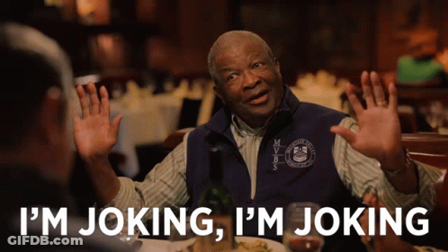 A Man In A Vest That Says Mvbs On It Says I 'M Joking GIF