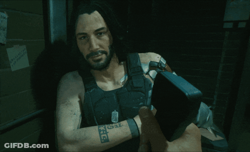 A Man In A Video Game Has A Tattoo On His Arm That Says K.i.d. GIF