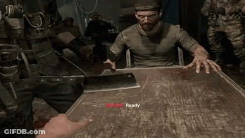 A Man In A Video Game Is Sitting At A Table With A Bloody Knife And The Word Ready On The Table GIF