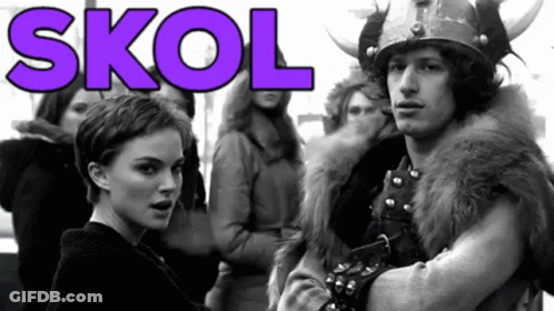 A Man In A Viking Costume Stands Next To A Woman In A Black And White Photo With The Word Skol In Purple GIF