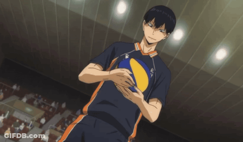 A Man In A Volleyball Uniform Holds A Yellow And Blue Ball GIF