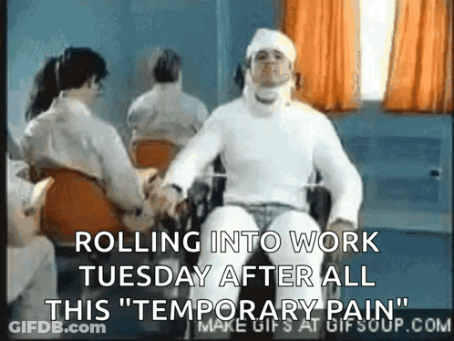 A Man In A Wheelchair Has A Bandage On His Head And Says Rolling Into Work Tuesday After All This Temporary Pain GIF