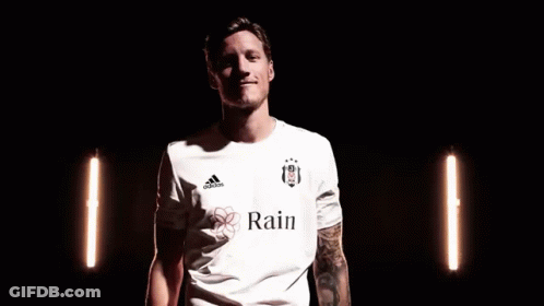 A Man In A White Adidas Shirt Is Making A Peace Sign With His Fingers . GIF
