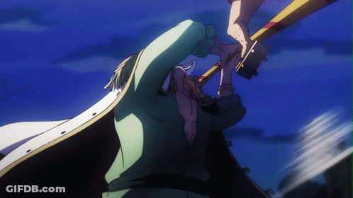 A Man In A White Cape Is Holding A Large Object In His Hand GIF