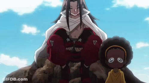 A Man In A White Cape Sits On A Rock Next To A Child GIF