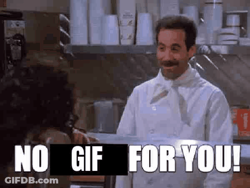 A Man In A White Chef 'S Coat Is Standing In A Kitchen Talking To A Woman . GIF