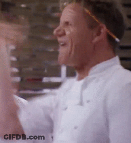 A Man In A White Chef 'S Uniform Is Laughing GIF