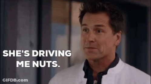 A Man In A White Coat Is Standing In Front Of A Window And Saying She 'S Driving Me Nuts . GIF