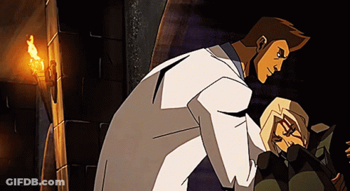 A Man In A White Coat Is Standing Next To A Woman GIF