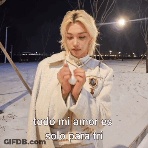 A Man In A White Coat Stands In The Snow With The Words Todo Mi Amor Es Solo Para Tri Written Below Him GIF
