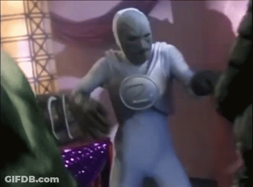 A Man In A White Costume With The Letter Z On His Chest Is Dancing GIF