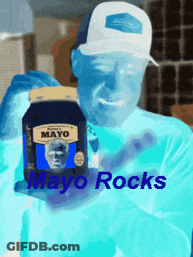 A Man In A White Hat Is Holding A Jar Of Mayo With The Words Mayo Rocks Below Him GIF