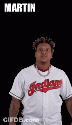 A Man In A White Indians Jersey Stands In Front Of A Black Background With The Name Martin Above Him GIF