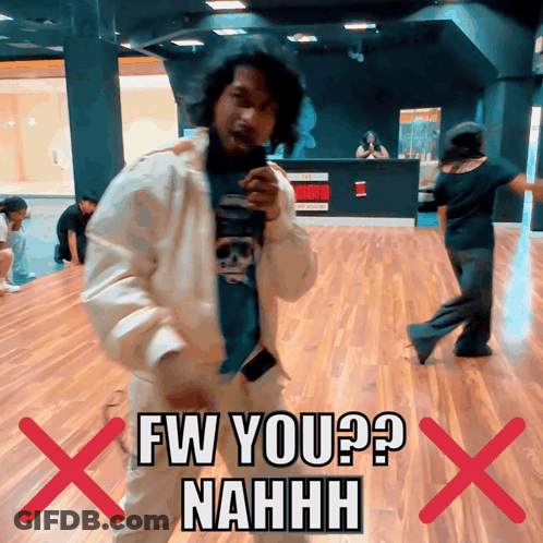 A Man In A White Jacket Is Dancing In Front Of A Sign That Says Fw You ? Nahhh GIF