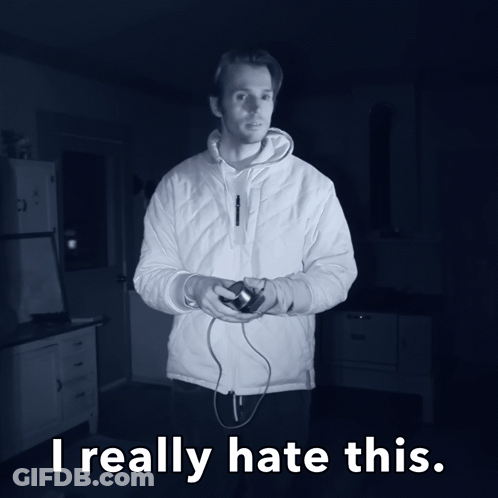 A Man In A White Jacket Is Holding A Video Game Controller And The Words I Really Hate This Are Below Him GIF