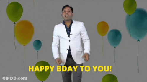 A Man In A White Jacket Says " Happy Bday To You " In Front Of Balloons GIF