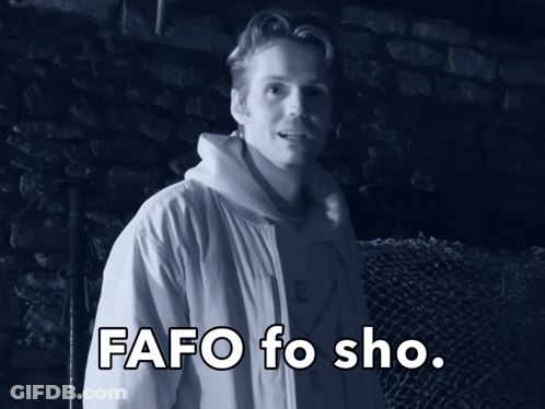 A Man In A White Jacket Stands In Front Of A Fence With The Words Fafo Fo Sho Written Below Him GIF