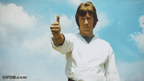 A Man In A White Karate Uniform Is Giving The Thumbs Up GIF