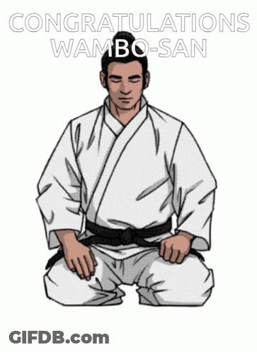 A Man In A White Karate Uniform Is Kneeling Down With The Words Congratulations Wamba-San Written Above Him GIF