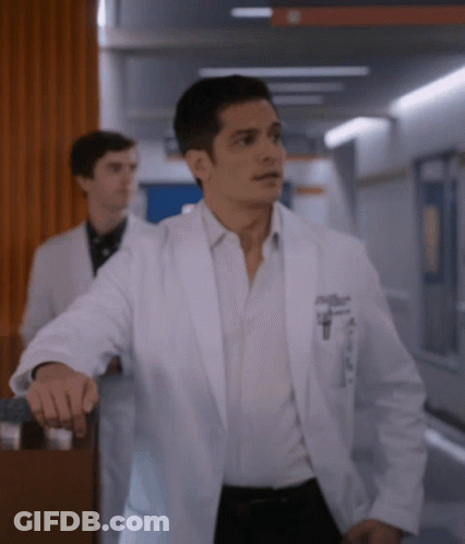 A Man In A White Lab Coat Has A Pocket With A Pen In It GIF