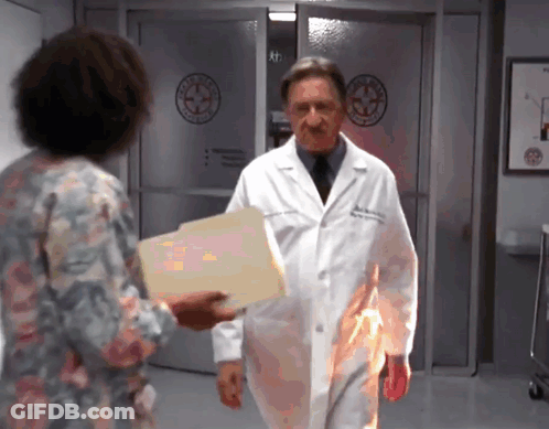 Lab Coat Man Giving Woman Paper GIF