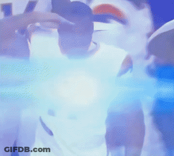 A Man In A White Nike Jersey Is Standing In A Crowd GIF
