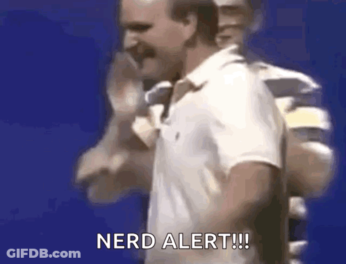 A Man In A White Polo Shirt Is Standing In Front Of A Blue Background . GIF