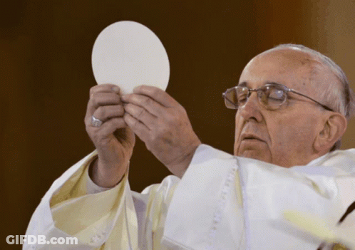 A Man In A White Robe Holds A White Plate In His Hands GIF