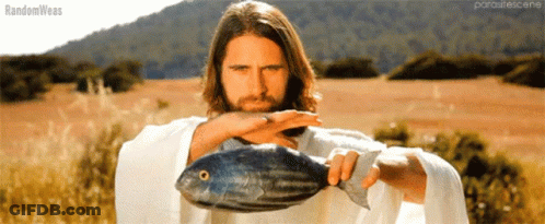 A Man In A White Robe Is Holding A Large Fish In His Hands And The Words Randomweas Are On The Bottom GIF