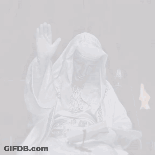 Man In White Robe Reading Book And Waving GIF