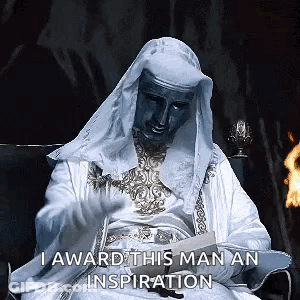 Man In White Robe Reading Book GIF