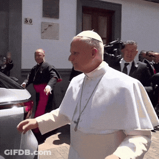 A Man In A White Robe Is Walking In Front Of A Building With A Number 30 On It GIF
