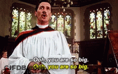 A Man In A White Robe Stands In Front Of A Stained Glass Window And Says Ooh You Are So Big GIF