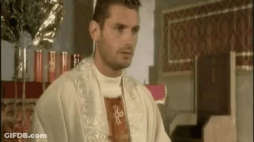 A Man In A White Robe With A Red Cross On His Chest GIF