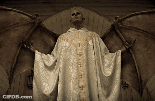 A Man In A White Robe With Gold Crosses On The Sleeves Has Wings GIF