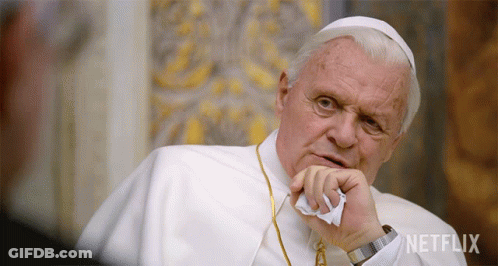 A Man In A White Robe With The Word Netflix On The Bottom Right GIF